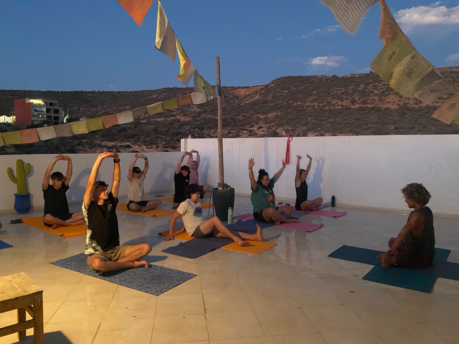 yoga on rooftop of the surfcamp in Tamraght